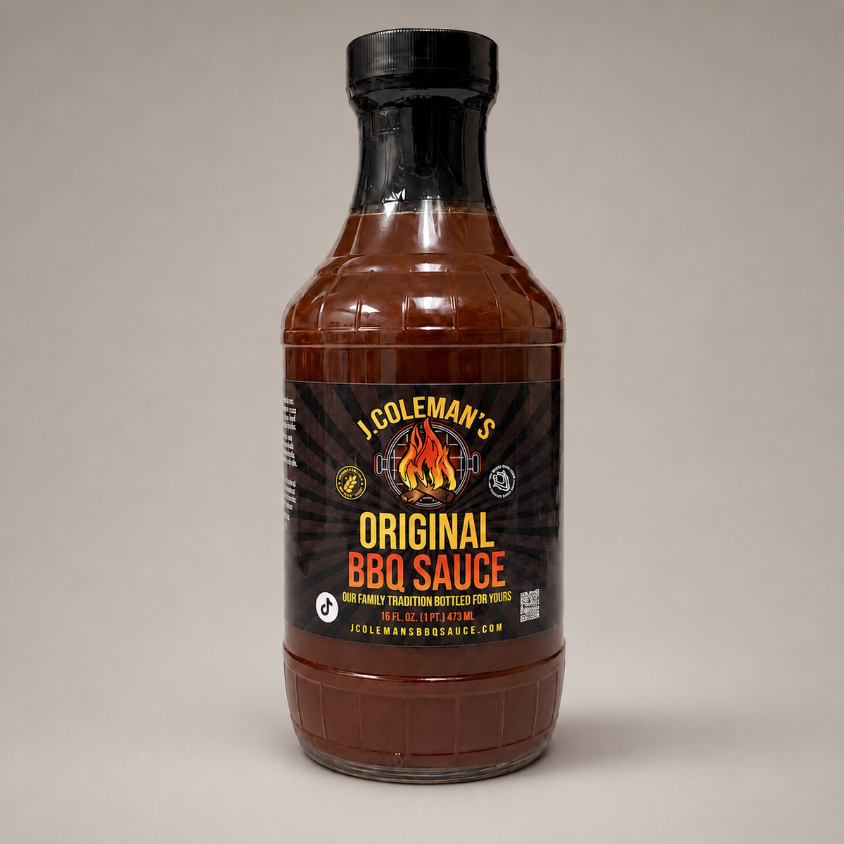 A bottle of J. Coleman's Original BBQ Sauce on a neutral gray background.