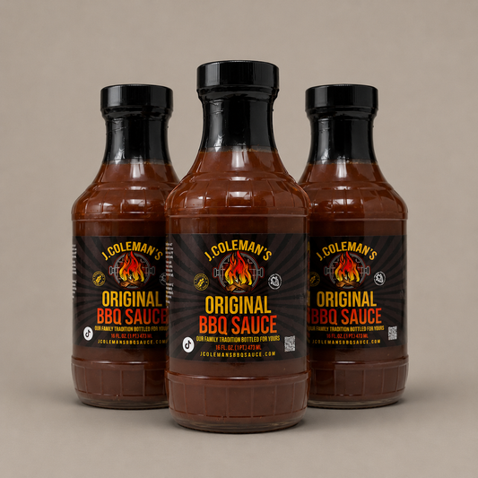 Three bottles of J. Coleman's Original BBQ Sauce arranged in a studio shot against a solid beige background, with the center bottle facing forward and the side bottles angled inward.