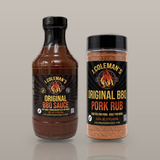 A bottle of J. Coleman's Original BBQ Sauce next to a jar of Original BBQ Pork Rub, part of the Sauce & Pork Rub Duo.
